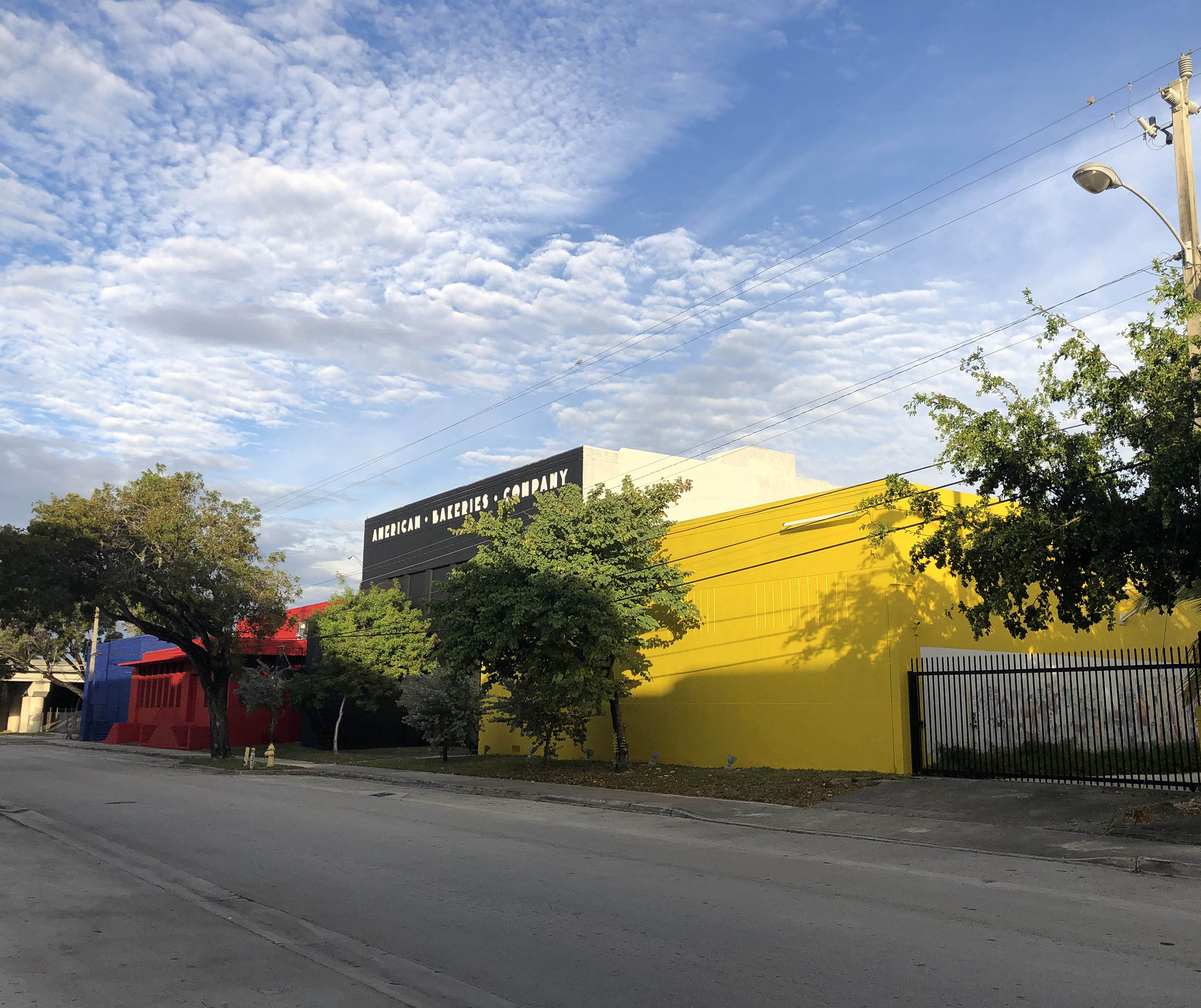 Bakehouse Art Complex exterior with yellow walls, photographed in November 2018.